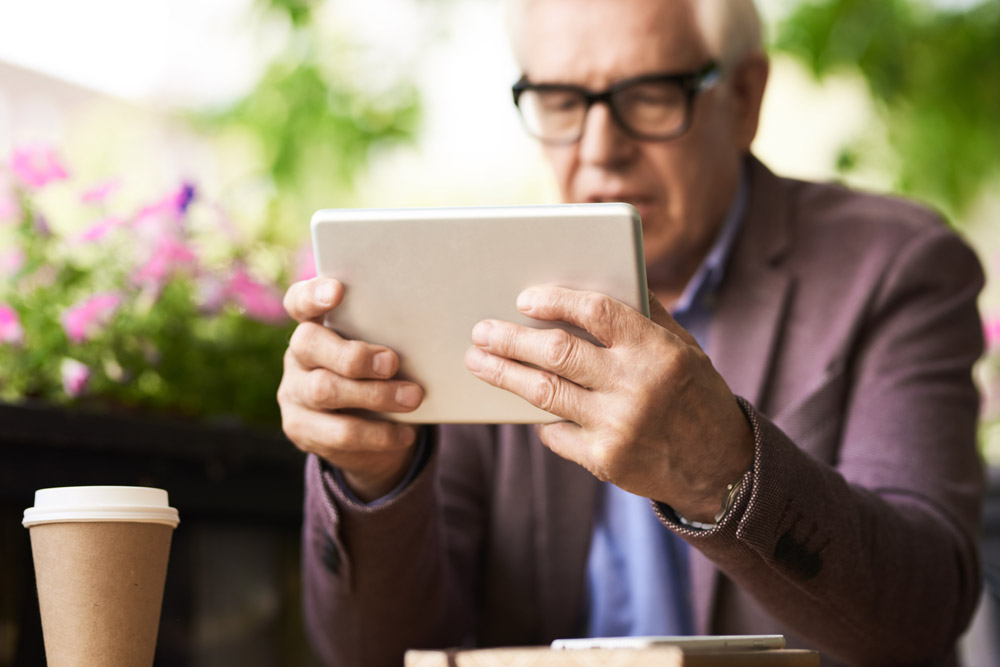 Grandpa Learning to use Digital Tablet